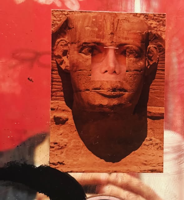 Red contemporary collage combining a face and an ancient sculptural head